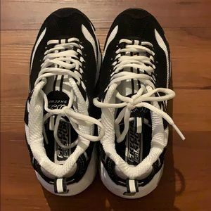 Skechers B&W shoes.